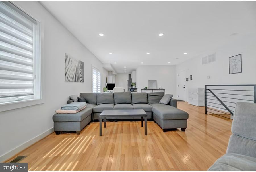1416 22nd Street Southeast, Unit 2 Washington, DC 20020 - Photo 6 of 18 a living room with furniture and a wooden floor