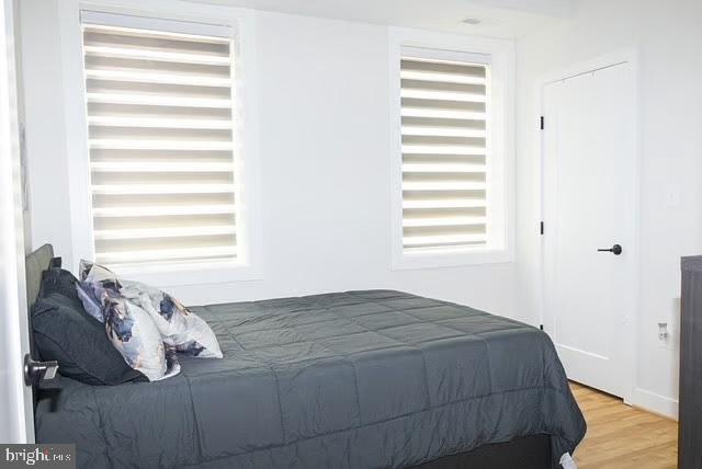1416 22nd Street Southeast, Unit 2 Washington, DC 20020 - Photo 7 of 18 a bedroom with a bed and a window