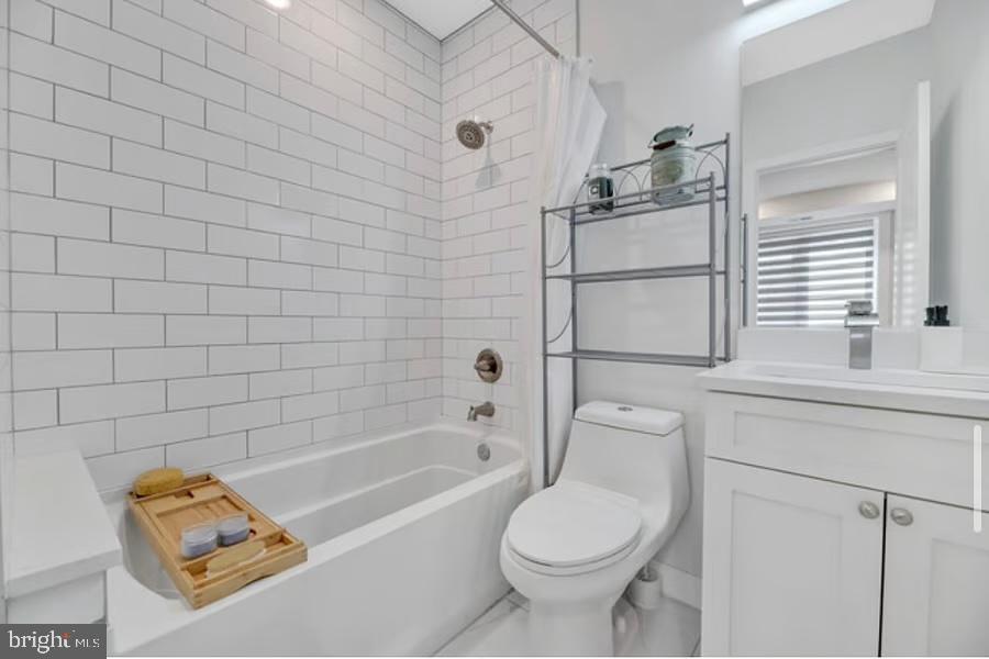 1416 22nd Street Southeast, Unit 2 Washington, DC 20020 - Photo 9 of 18 a bathroom with a sink a toilet and shower