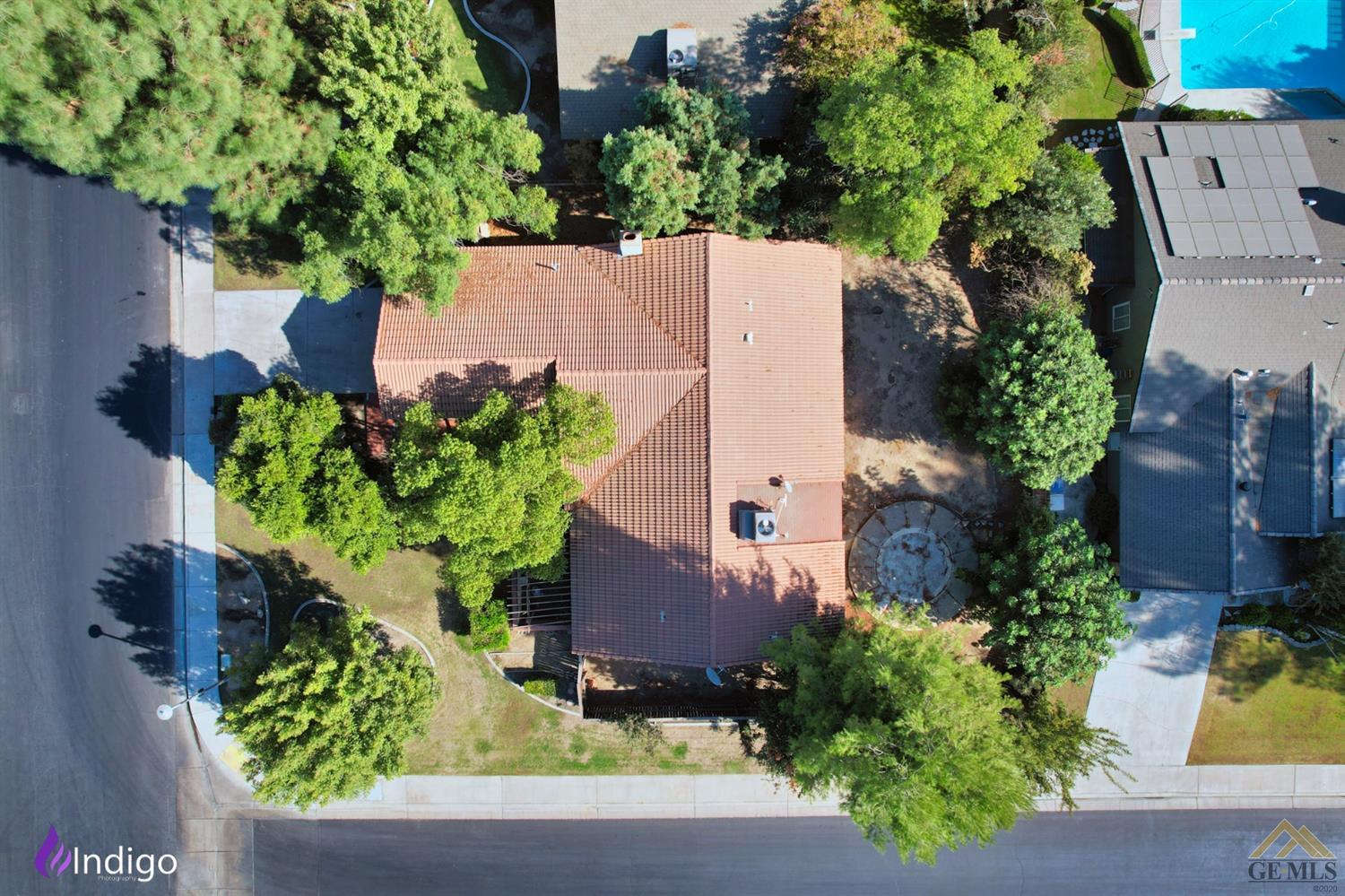 an aerial view of a house with a yard outdoor seating