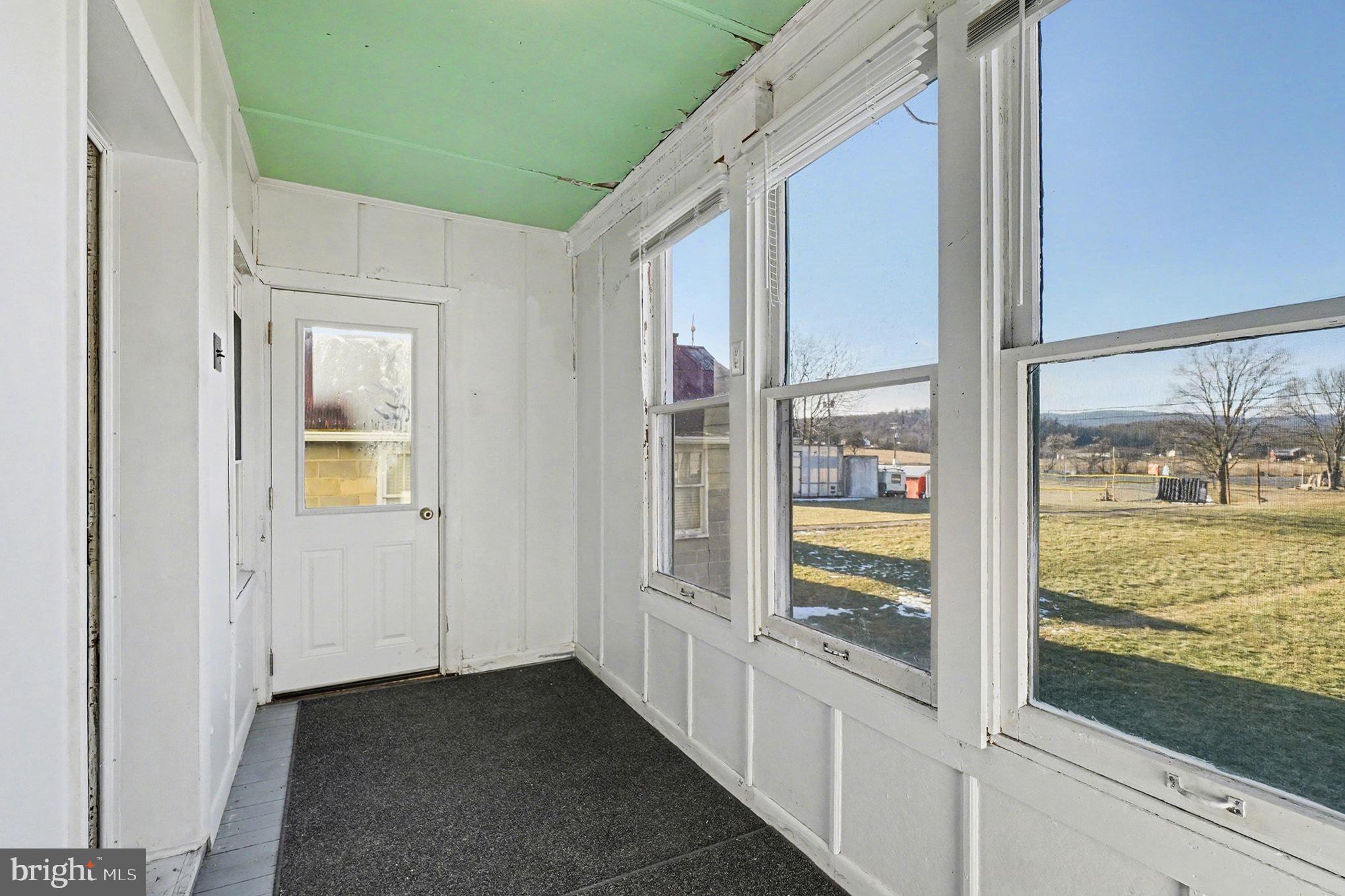 325 East Market Street Beavertown, PA 17813 - Photo 21 of 41 325 unheated rear enclosed porch, storage mud room