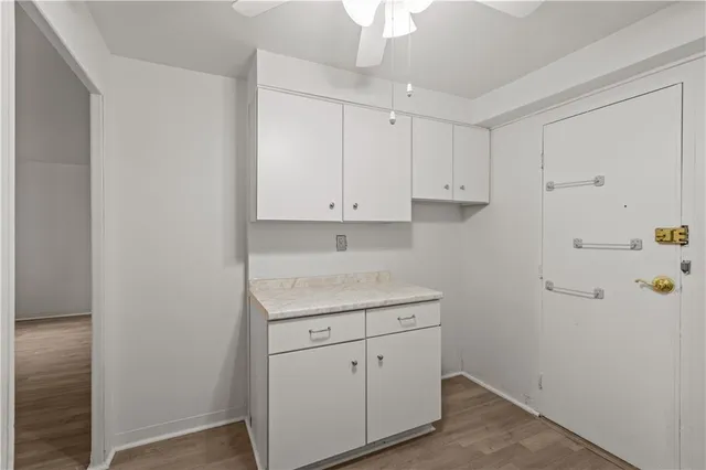 a view of cabinets with wooden floor