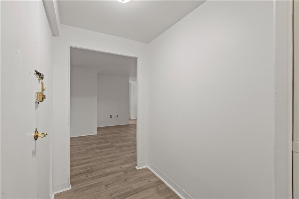 4625 Fifth Avenue, Unit 209 Pittsburgh, PA 15213 - Photo 16 of 23 a view of a hallway with wooden floor