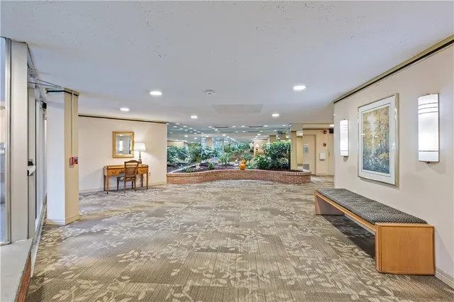 a view of livingroom with furniture and front door