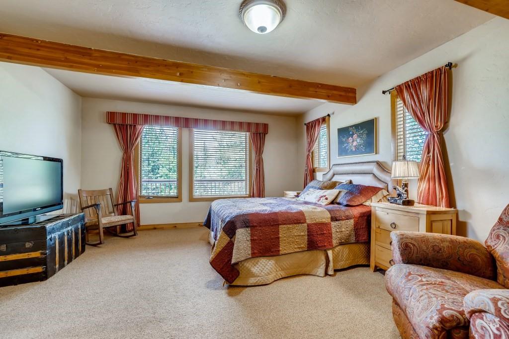 72 Aa Road Silverthorne, CO 80498 - Photo 15 of 28 a bedroom with furniture and a flat screen tv