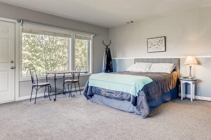 72 Aa Road Silverthorne, CO 80498 - Photo 18 of 28 a spacious bedroom with a bed and a large window