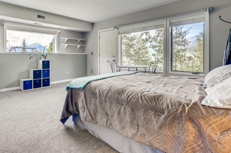 72 Aa Road Silverthorne, CO 80498 - Photo 19 of 28 a bed sitting in a room next to a window