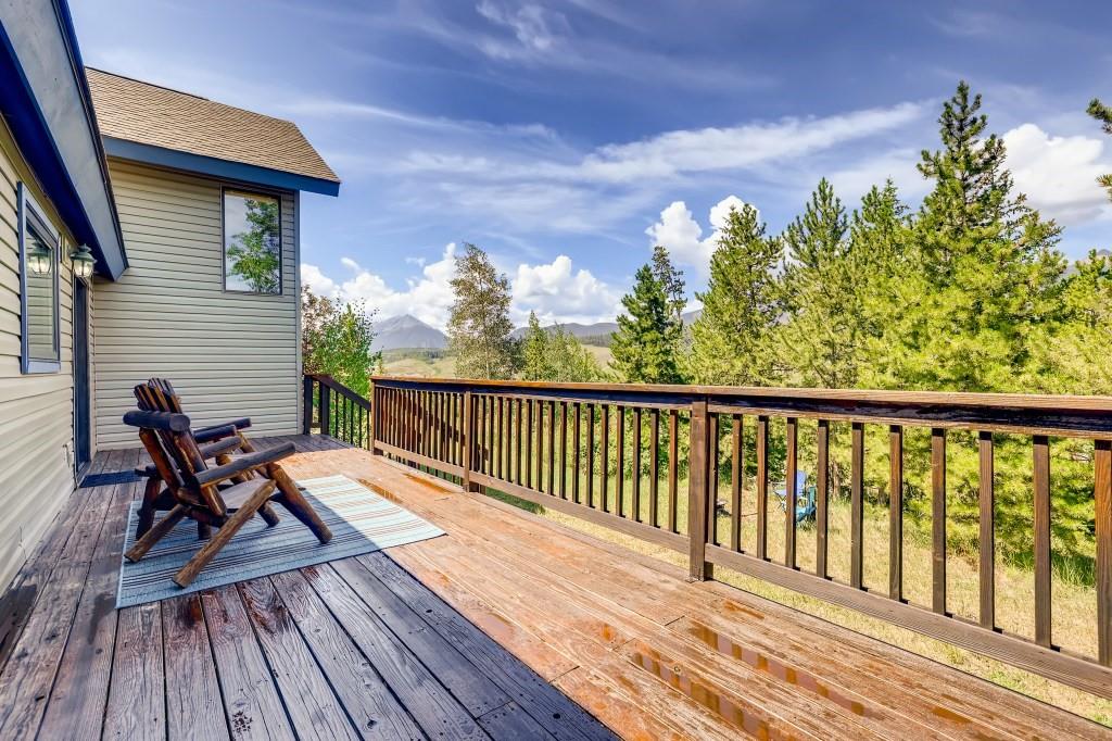 72 Aa Road Silverthorne, CO 80498 - Photo 23 of 28 a balcony with wooden floor table and chairs