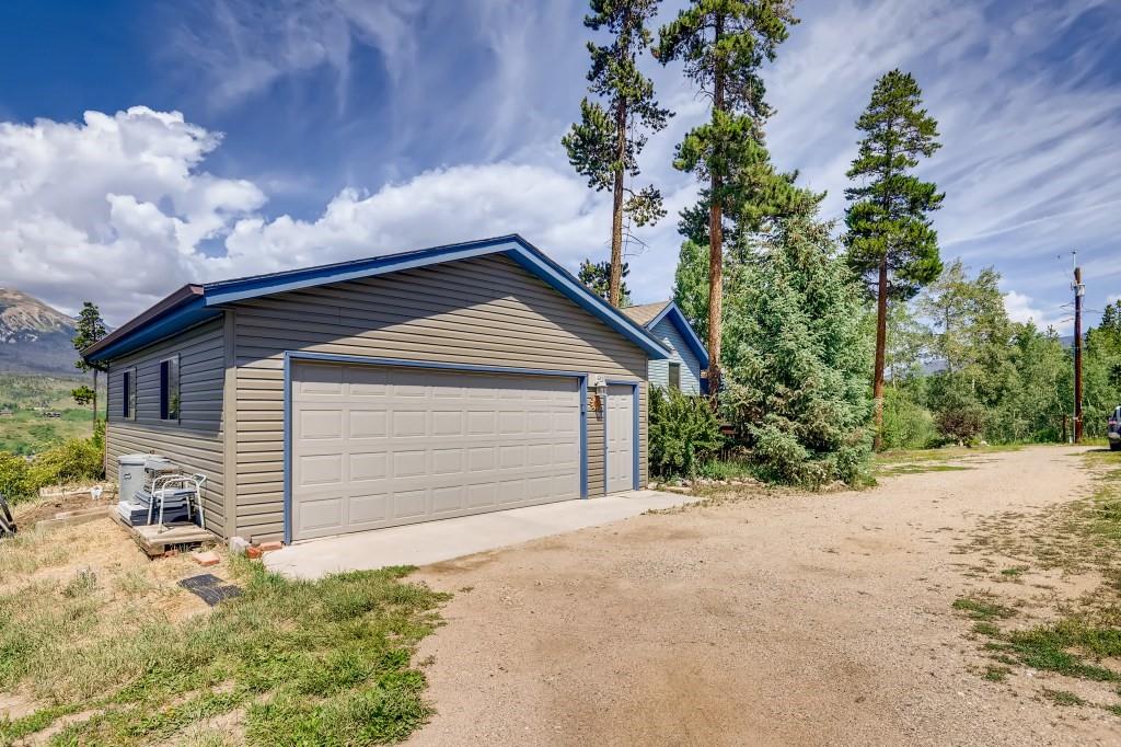 72 Aa Road Silverthorne, CO 80498 - Photo 28 of 28 a small white house with a yard and garage