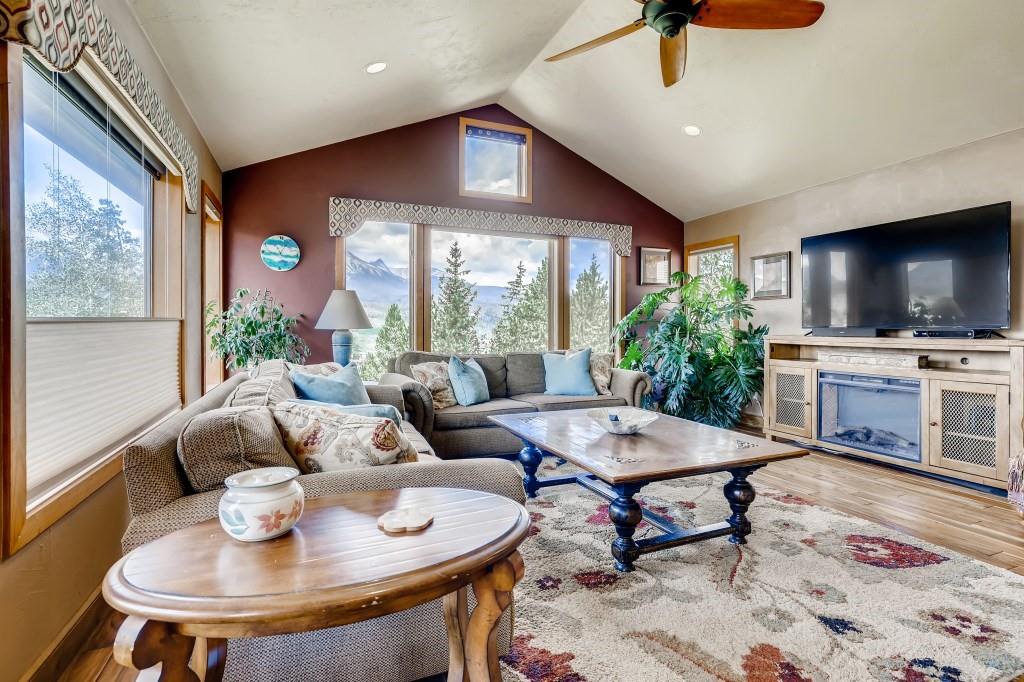 72 Aa Road Silverthorne, CO 80498 - Photo 7 of 28 a living room with fireplace furniture and a flat screen tv