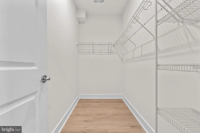 a view of a room with racks on the wall