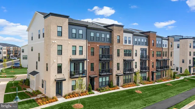 a view of residential building with a yard