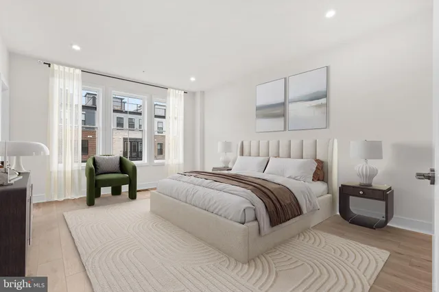 a spacious bedroom with a bed and a couch