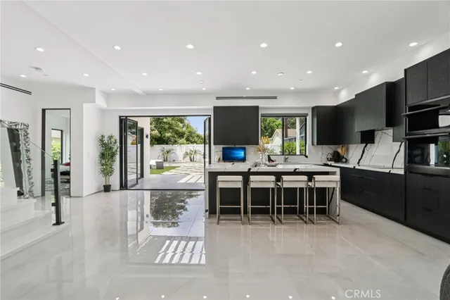 a view of staircase with lots of frames and a rug
