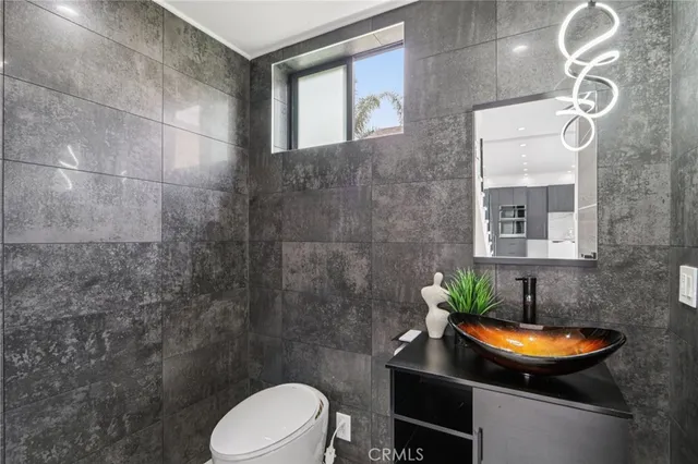 a large bedroom with 2 bed and a large window