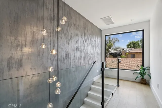 a bedroom with furniture and a potted plant