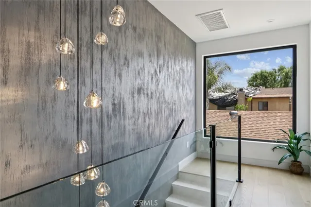 a living room filled with furniture and a potted plant