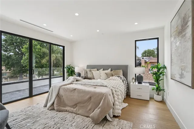 a bedroom with a bed and a view of bathroom