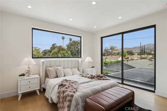 a view of a house with a small yard and plants