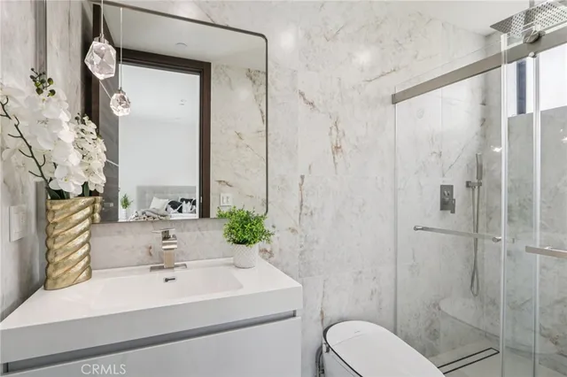 a view of a patio with table and chairs under an umbrella