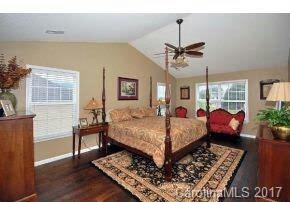 36 Wildbriar Road, Unit 2 Fletcher, NC 28732 - Photo 11 of 12 a bed room with a bed mirror and a window
