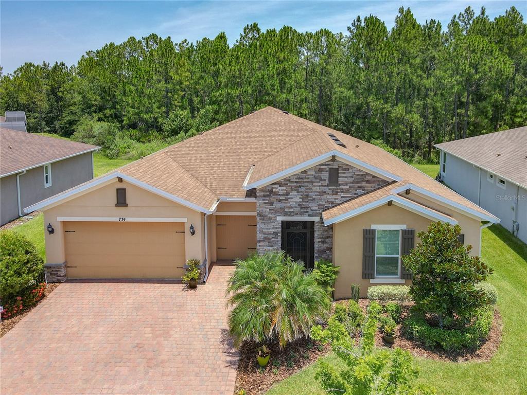 774 Irvine Ranch Road Poinciana, FL 34759 - Photo 1 of 1 front view of a house with a yard