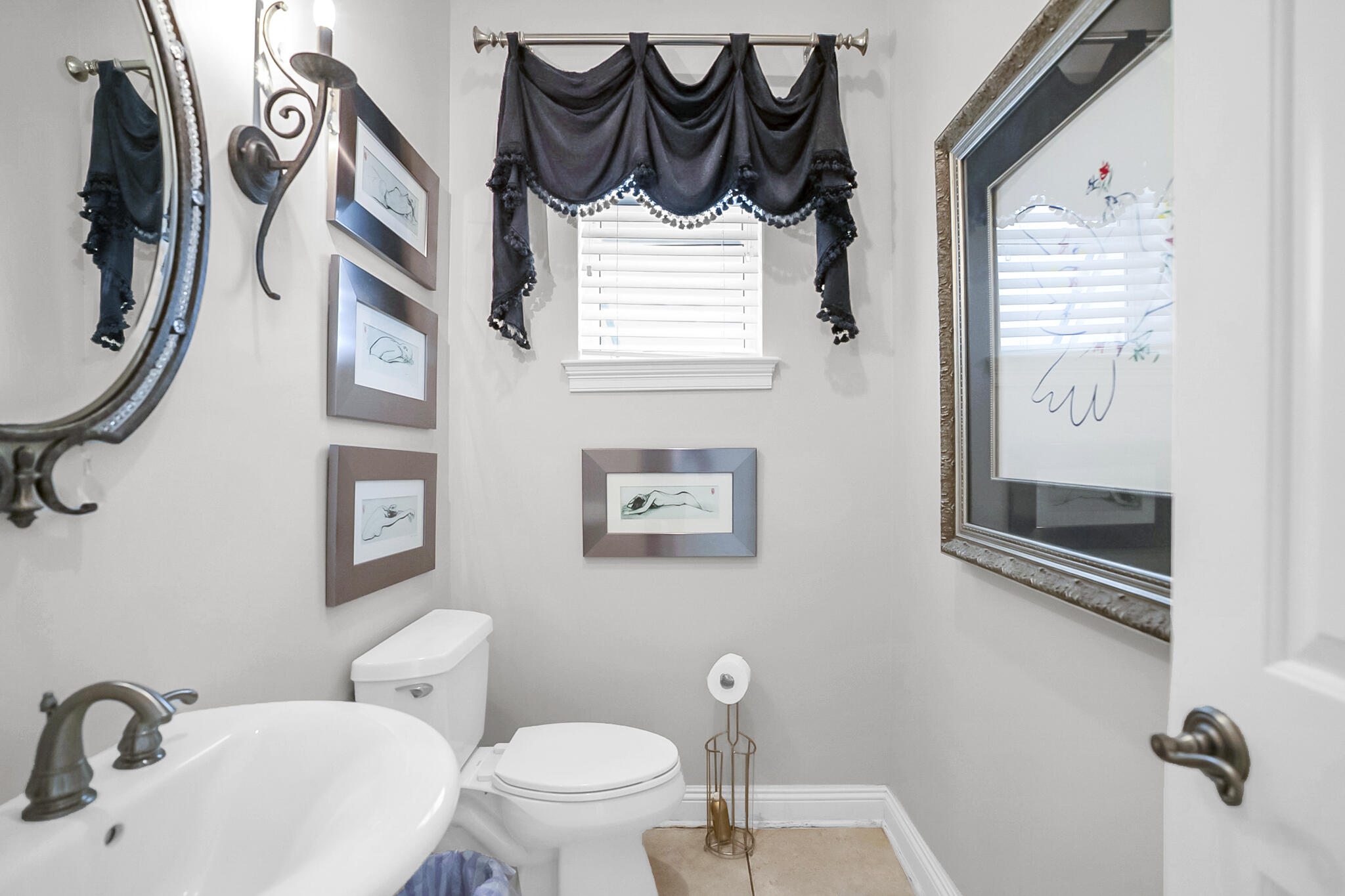 4372 Stonebridge Road Destin, FL 32541 - Photo 33 of 83 a bathroom with a toilet sink and mirror