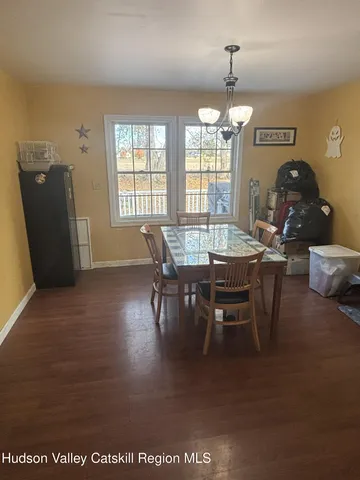 a bathroom with a sink vanity and toilet