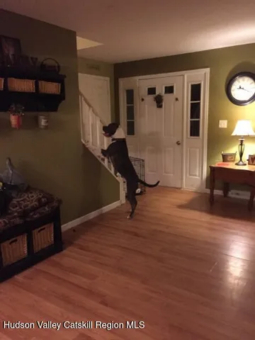 a bed sitting in a room next to a window