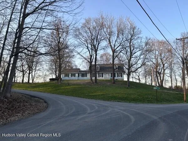 a view of deck with table and chairs couches with wooden floor and fence