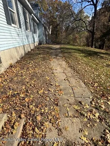 a view of entryway with a large window and wooden floor