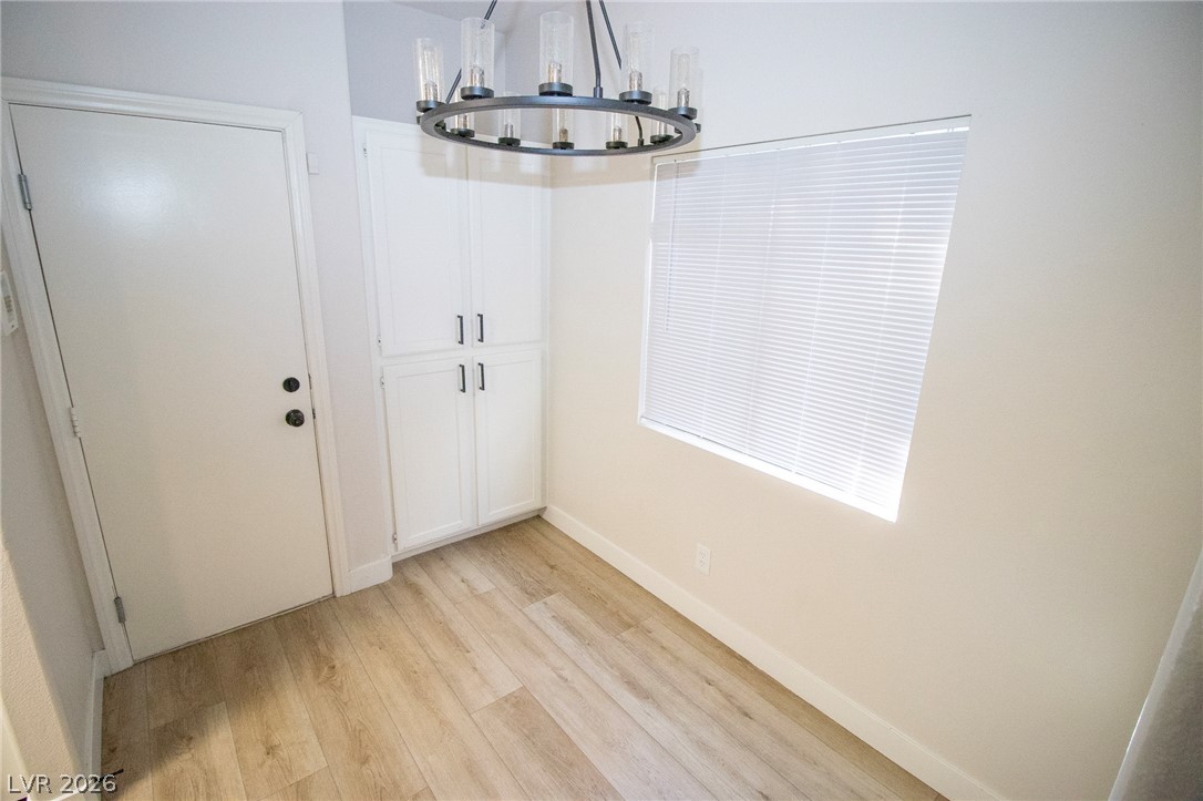 1468 Reef Ridge Court Las Vegas, NV 89128 - Photo 7 of 22 Functional entry area with durable wood-look flooring and ample built-in storage.