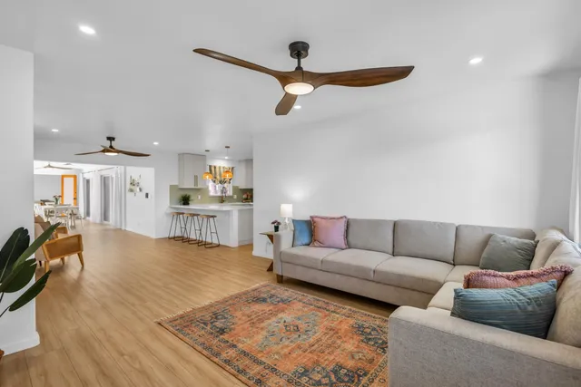 a living room with furniture and a rug