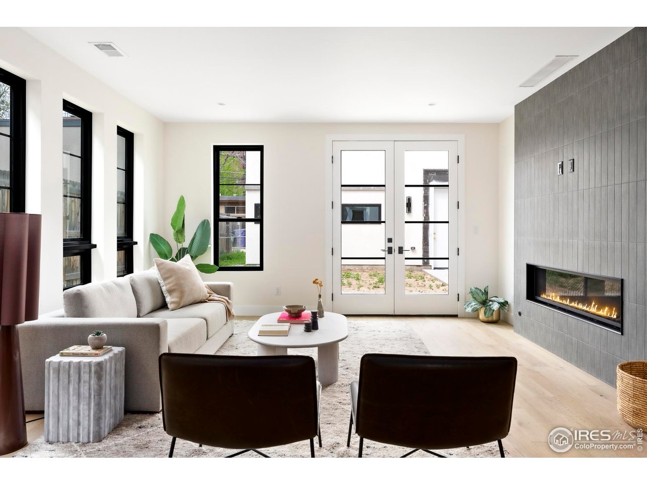 855 Eudora Street Denver, CO 80220 - Photo 12 of 37 a living room with furniture and a fireplace