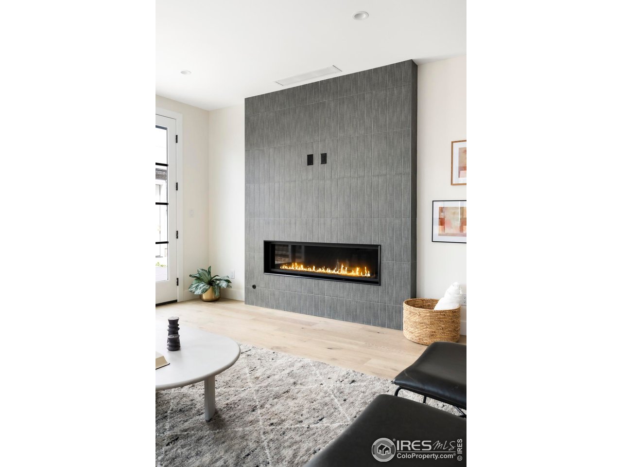 855 Eudora Street Denver, CO 80220 - Photo 13 of 37 a living room with furniture and a fireplace