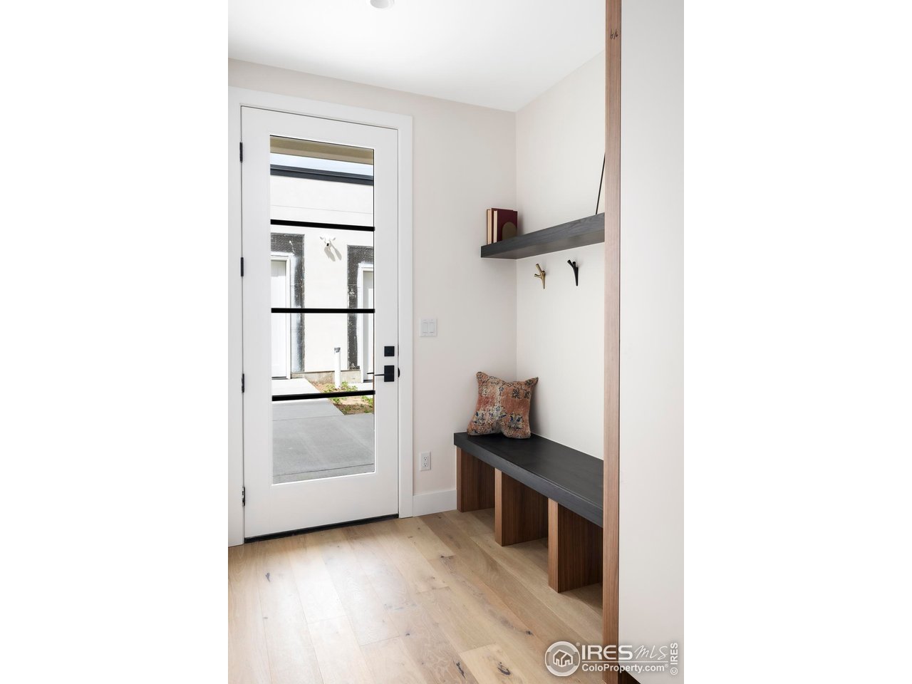 855 Eudora Street Denver, CO 80220 - Photo 14 of 37 a kitchen with a refrigerator and white cabinets