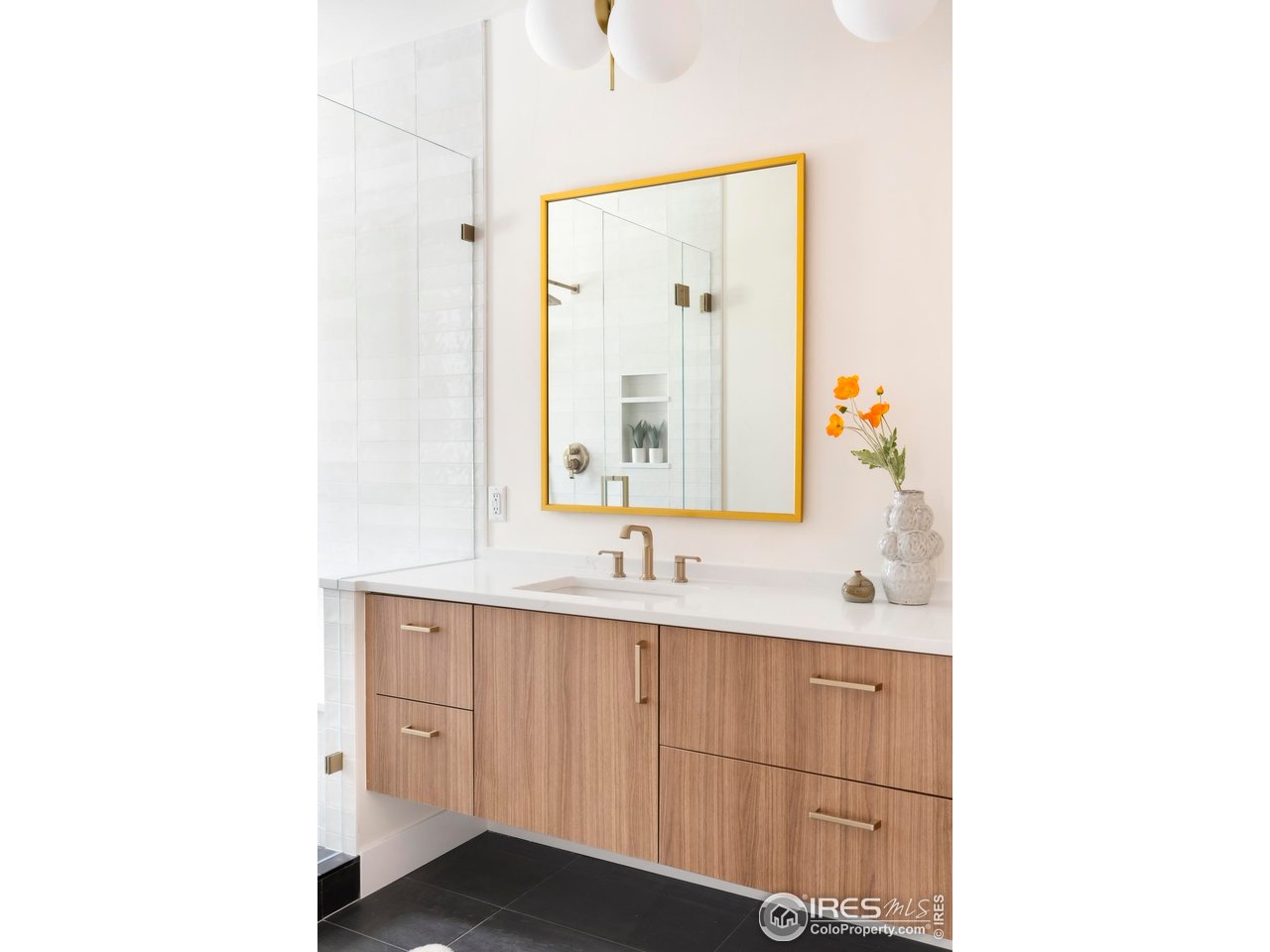 855 Eudora Street Denver, CO 80220 - Photo 19 of 37 a bathroom with a sink and a mirror
