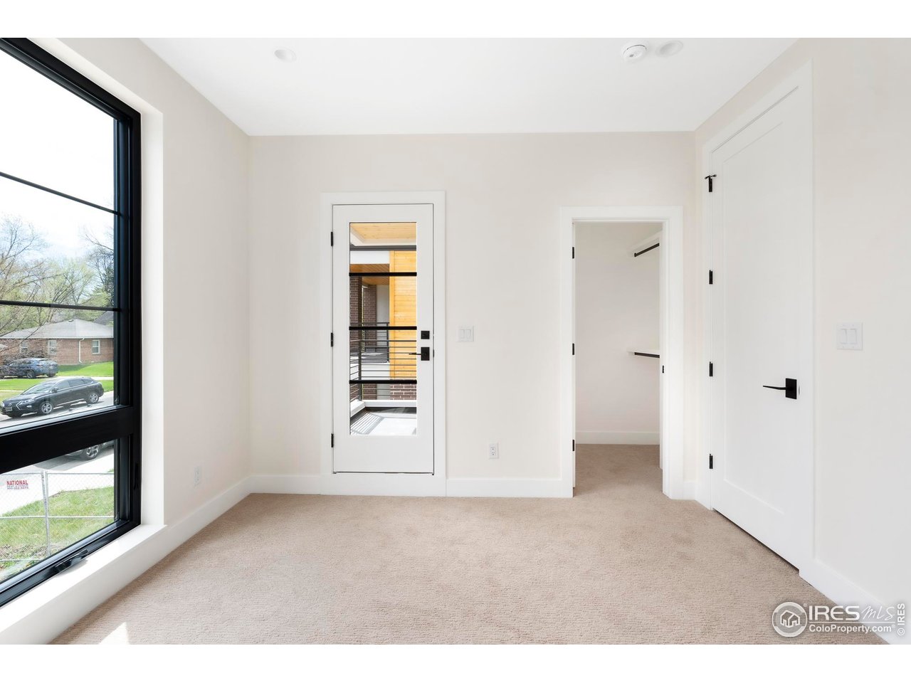 855 Eudora Street Denver, CO 80220 - Photo 23 of 37 an empty room with windows and closet