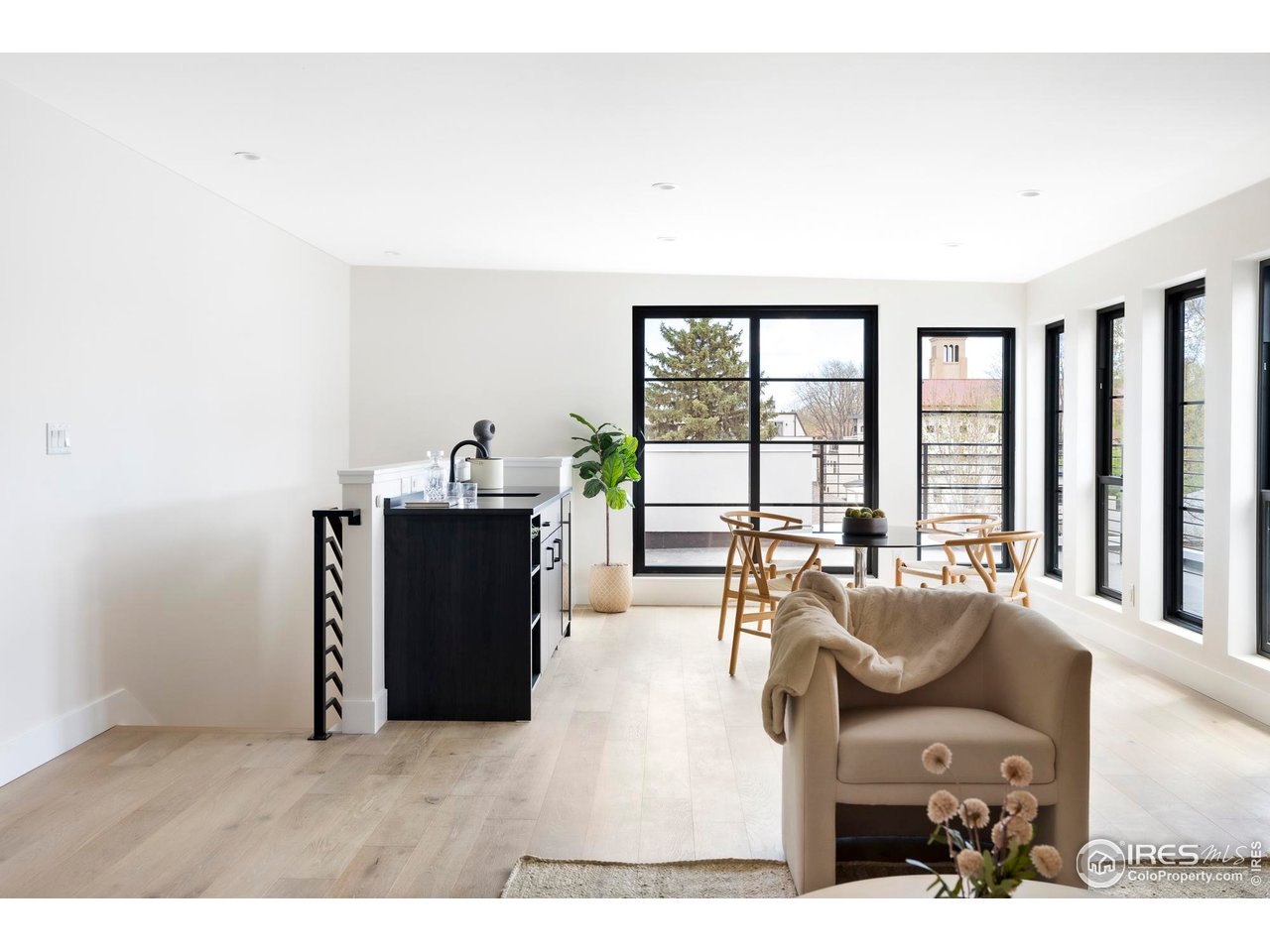 855 Eudora Street Denver, CO 80220 - Photo 27 of 37 a living room with furniture and large windows