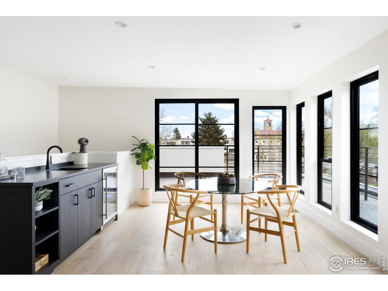 855 Eudora Street Denver, CO 80220 - Photo 28 of 37 a open kitchen with granite countertop a sink cabinets and stainless steel appliances