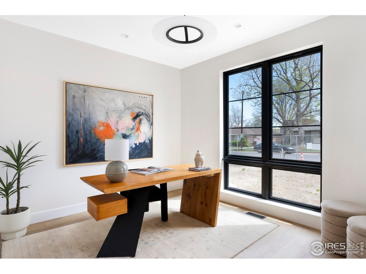 855 Eudora Street Denver, CO 80220 - Photo 5 of 37 a view of a dining room with furniture window and wooden floor