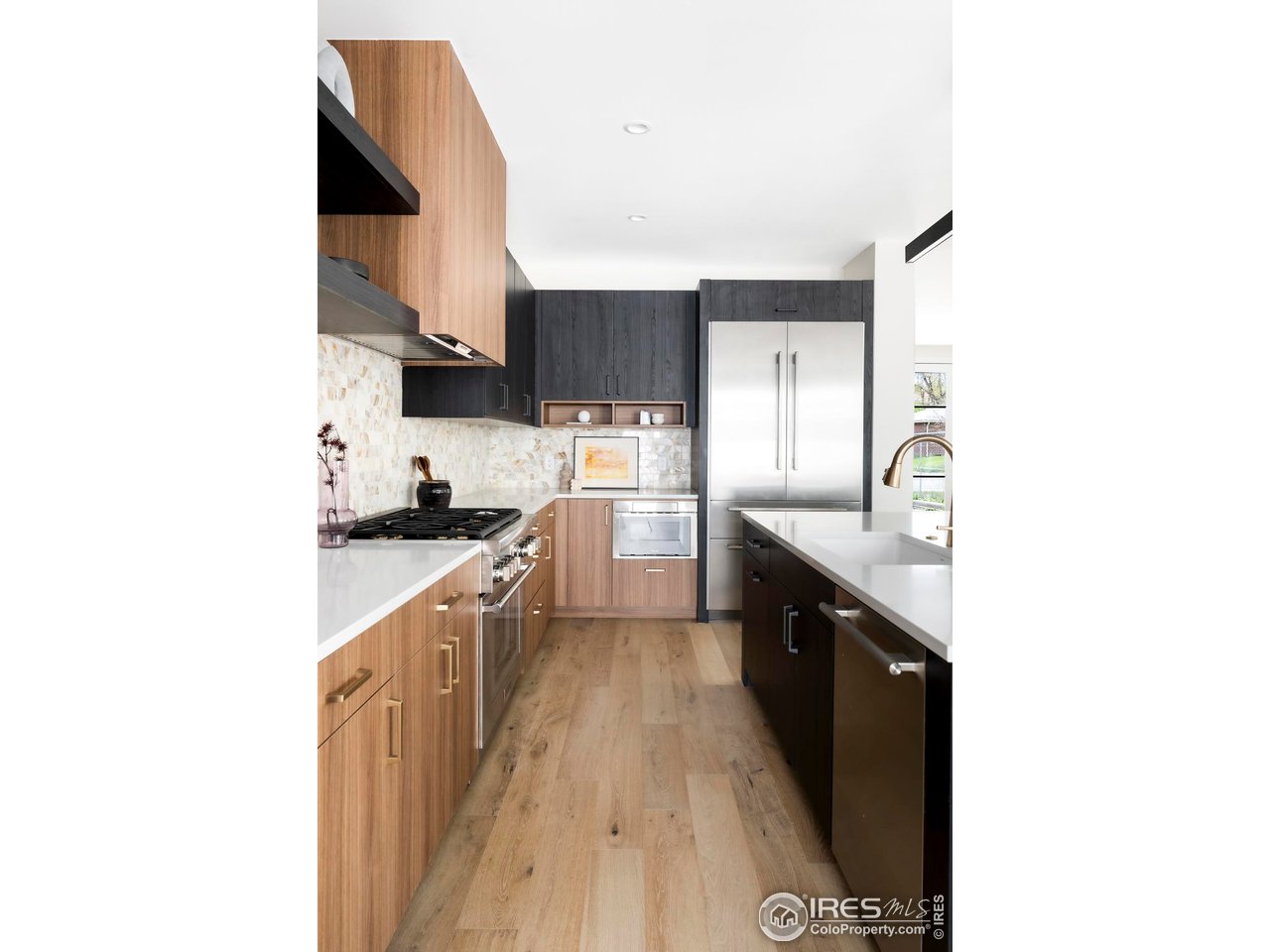 855 Eudora Street Denver, CO 80220 - Photo 9 of 37 a kitchen with granite countertop a sink and cabinets