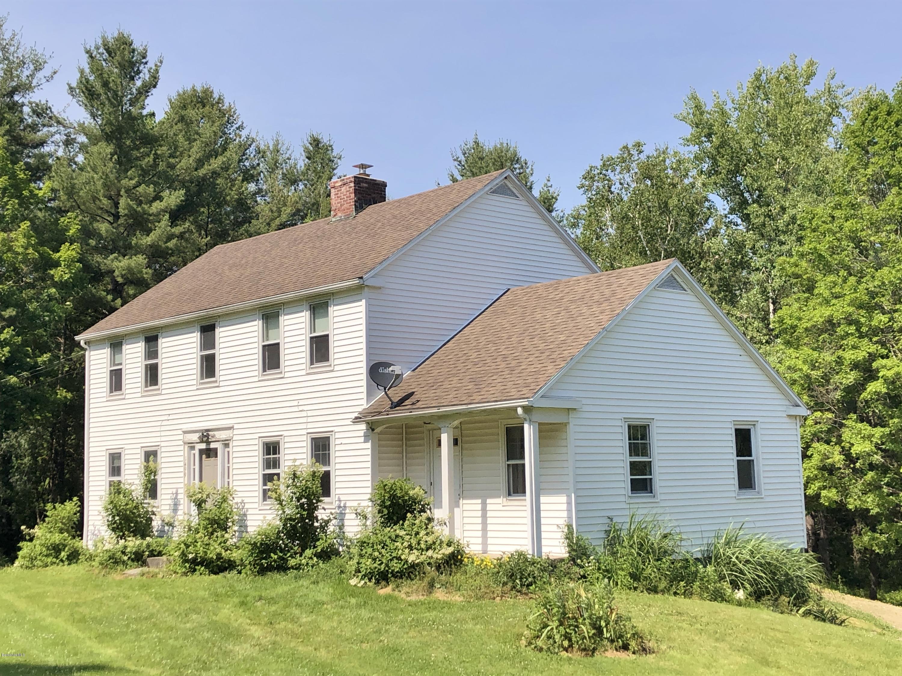 1499 State Road Richmond, MA 01254 - Photo 1 of 25 a view of a white house next to a yard