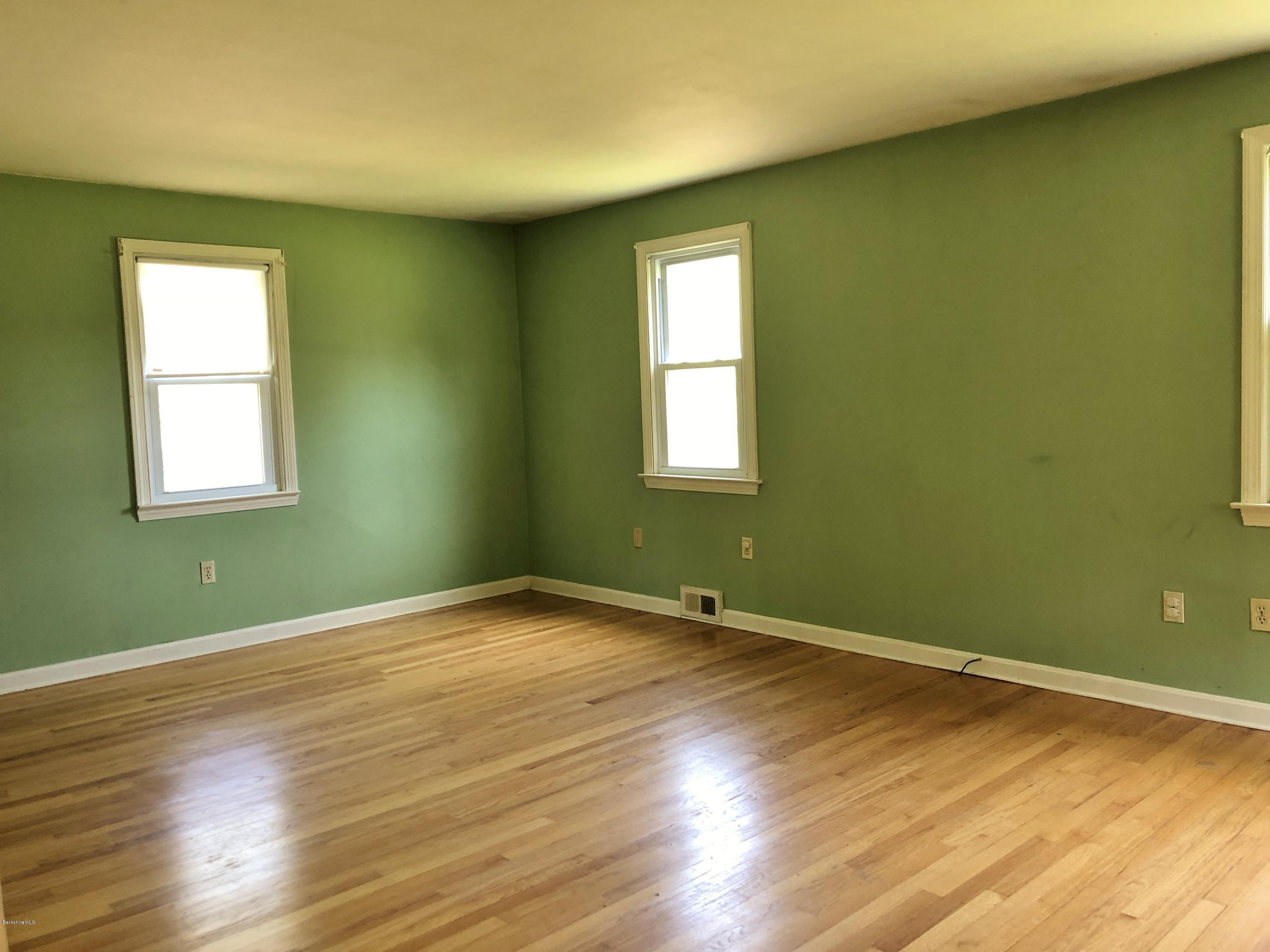 1499 State Road Richmond, MA 01254 - Photo 2 of 25 a view of an empty room with wooden floor and a window