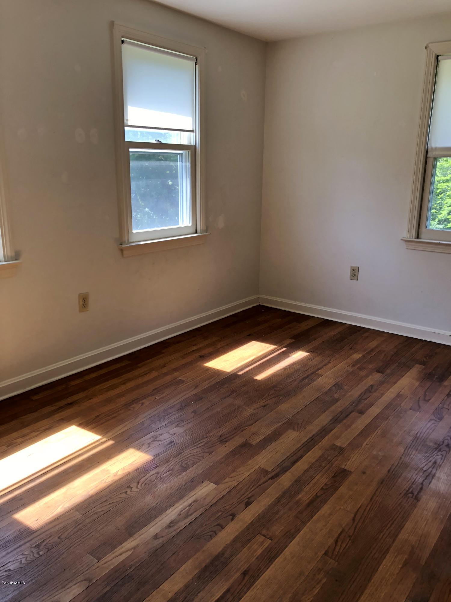 1499 State Road Richmond, MA 01254 - Photo 11 of 25 a view of an empty room with wooden floor and a window
