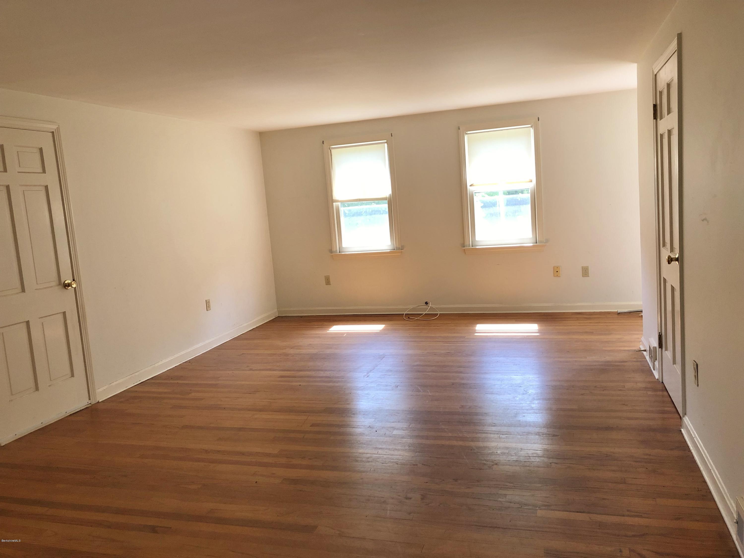 1499 State Road Richmond, MA 01254 - Photo 12 of 25 an empty room with wooden floor and windows