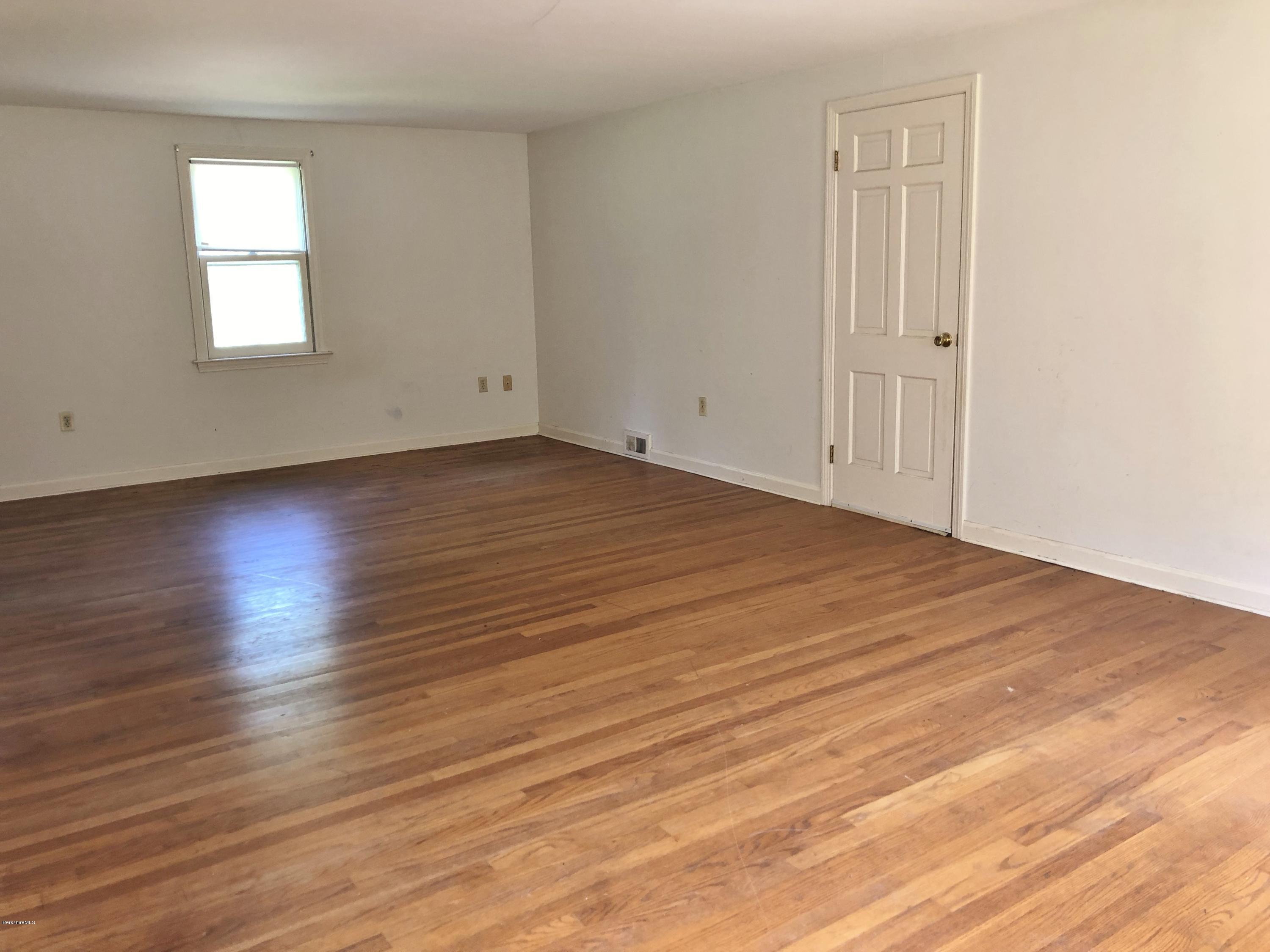 1499 State Road Richmond, MA 01254 - Photo 13 of 25 an empty room with wooden floor and windows