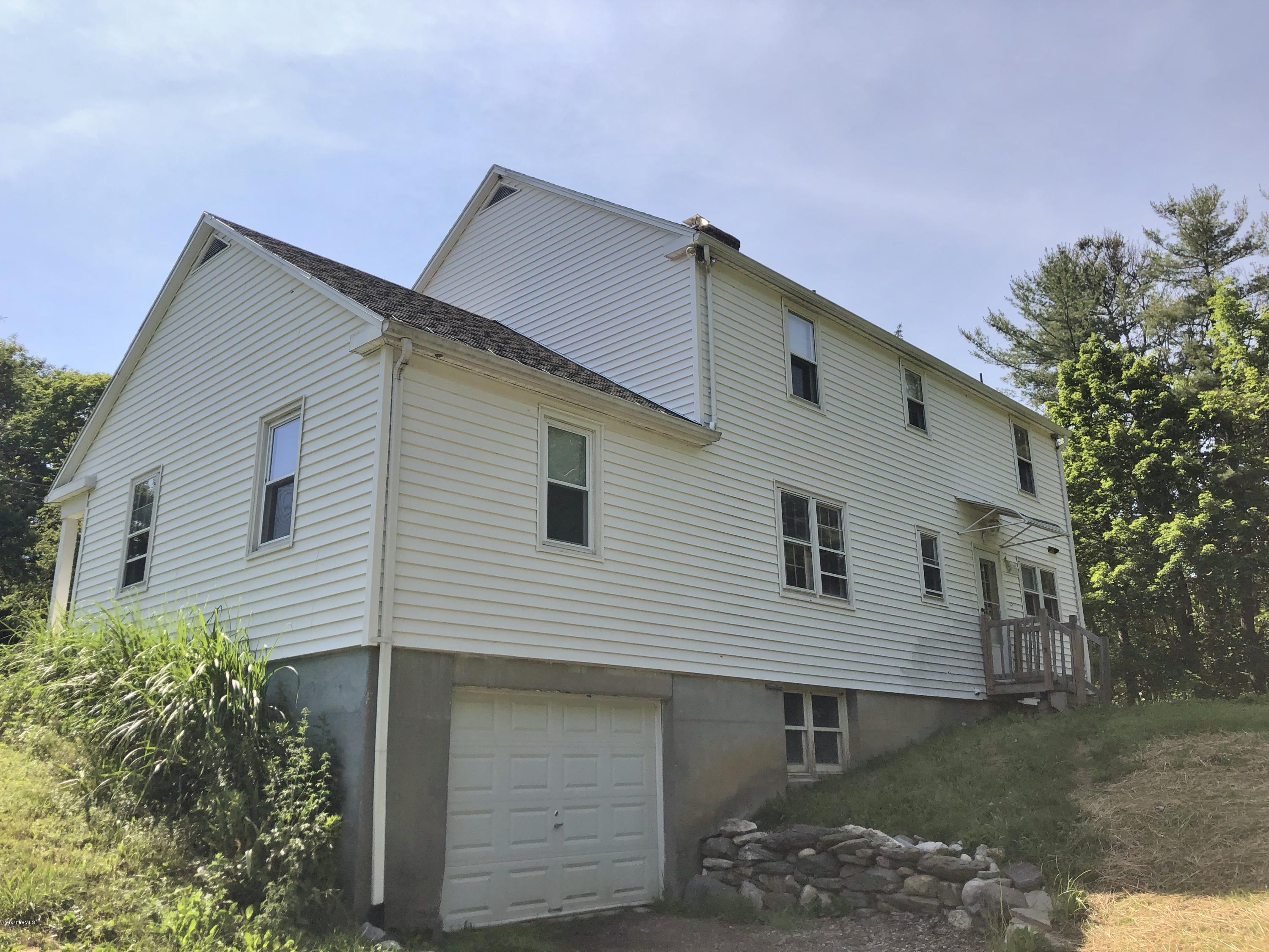 1499 State Road Richmond, MA 01254 - Photo 14 of 25 a front view of a house with a yard
