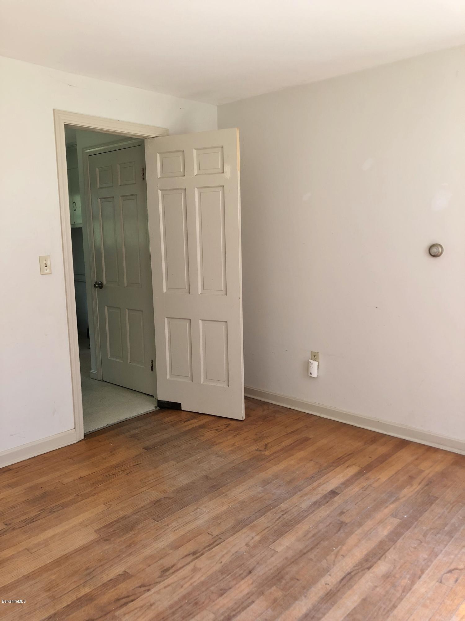 1499 State Road Richmond, MA 01254 - Photo 5 of 25 a view of an empty room and wooden floor