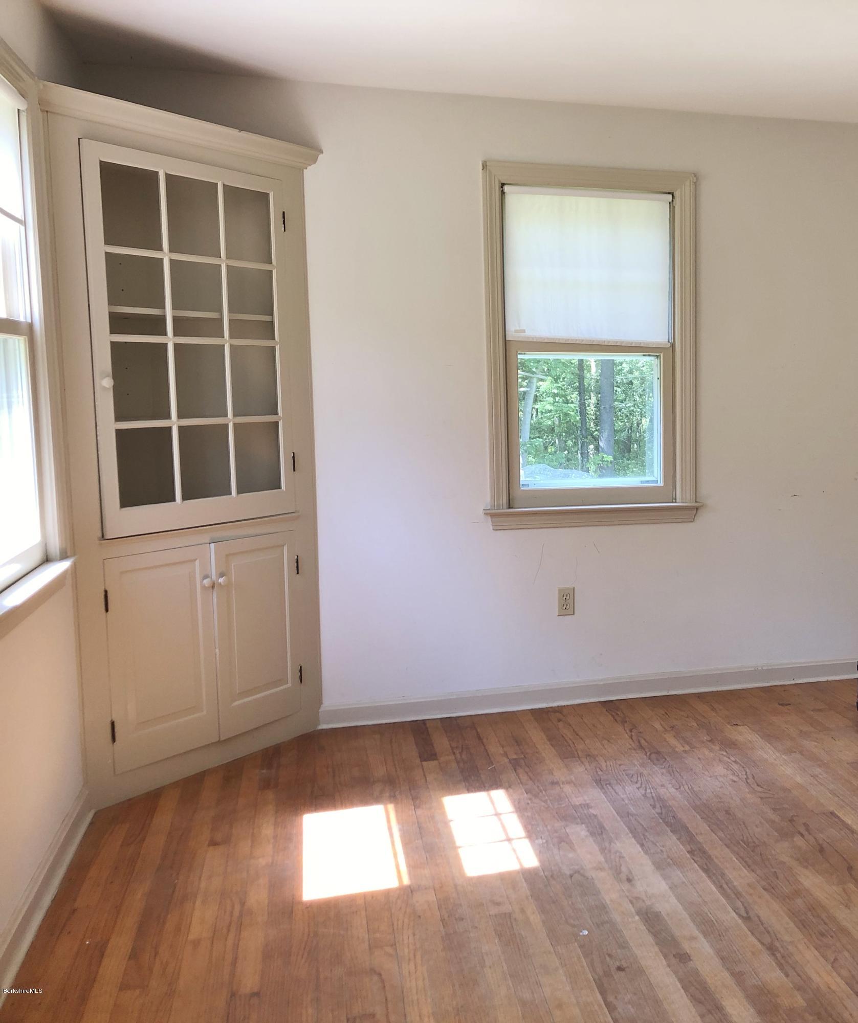1499 State Road Richmond, MA 01254 - Photo 7 of 25 an empty room with wooden floor and windows